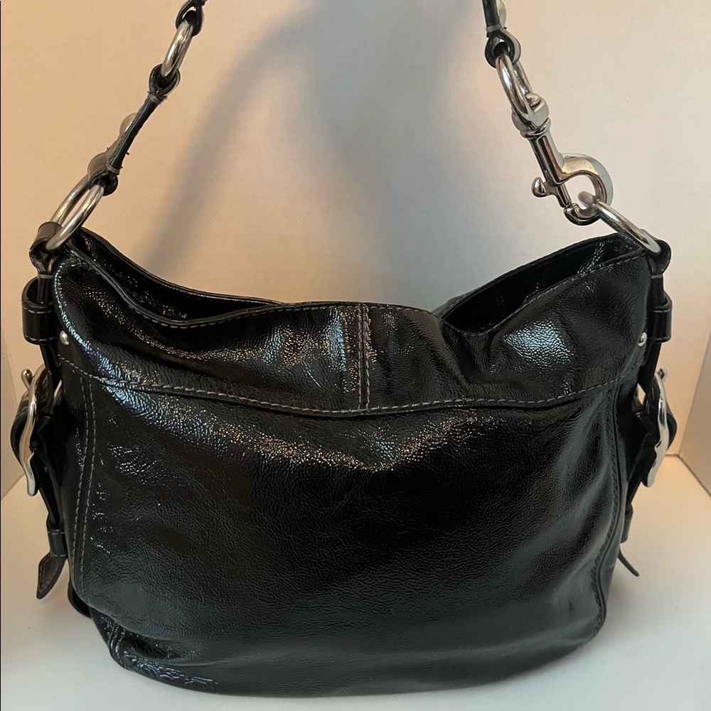 Black Coach patent leather hobo purse
12” long x 10” high x 4” deep.